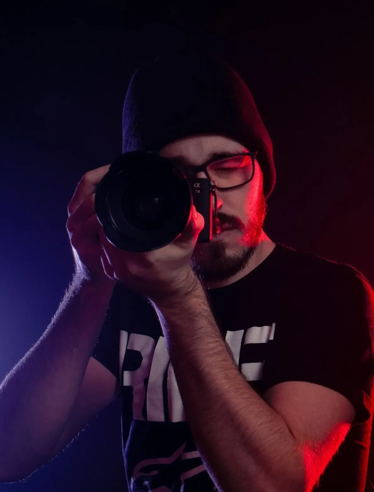 A photographer framing a shot on a medium-format body